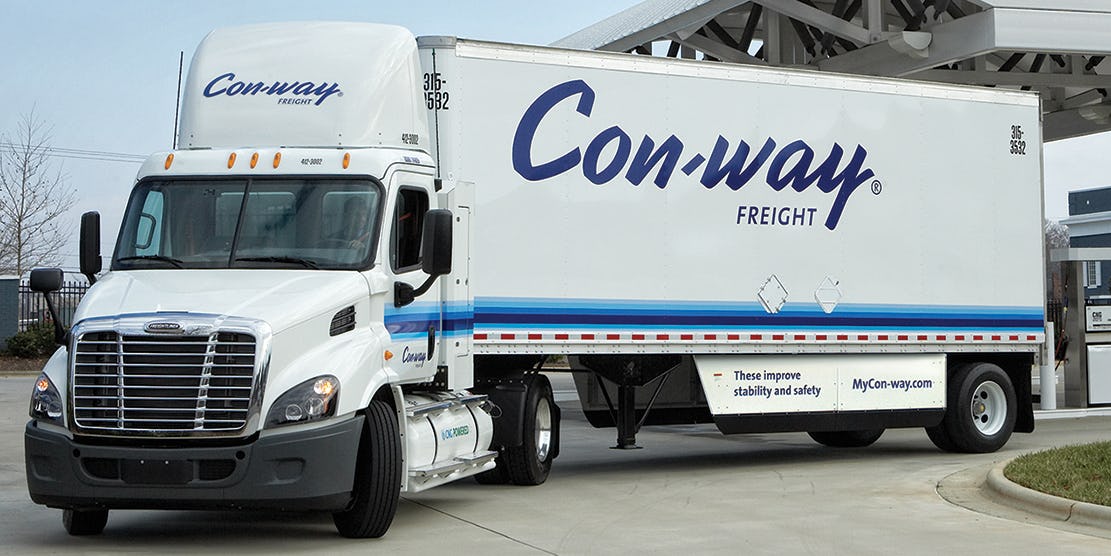 Freightliner image shows a Cascadia 113 for Con-way Freight leaving a fueling station in Rock Hill, S.C. after taking on its first fill of compressed natural gas.