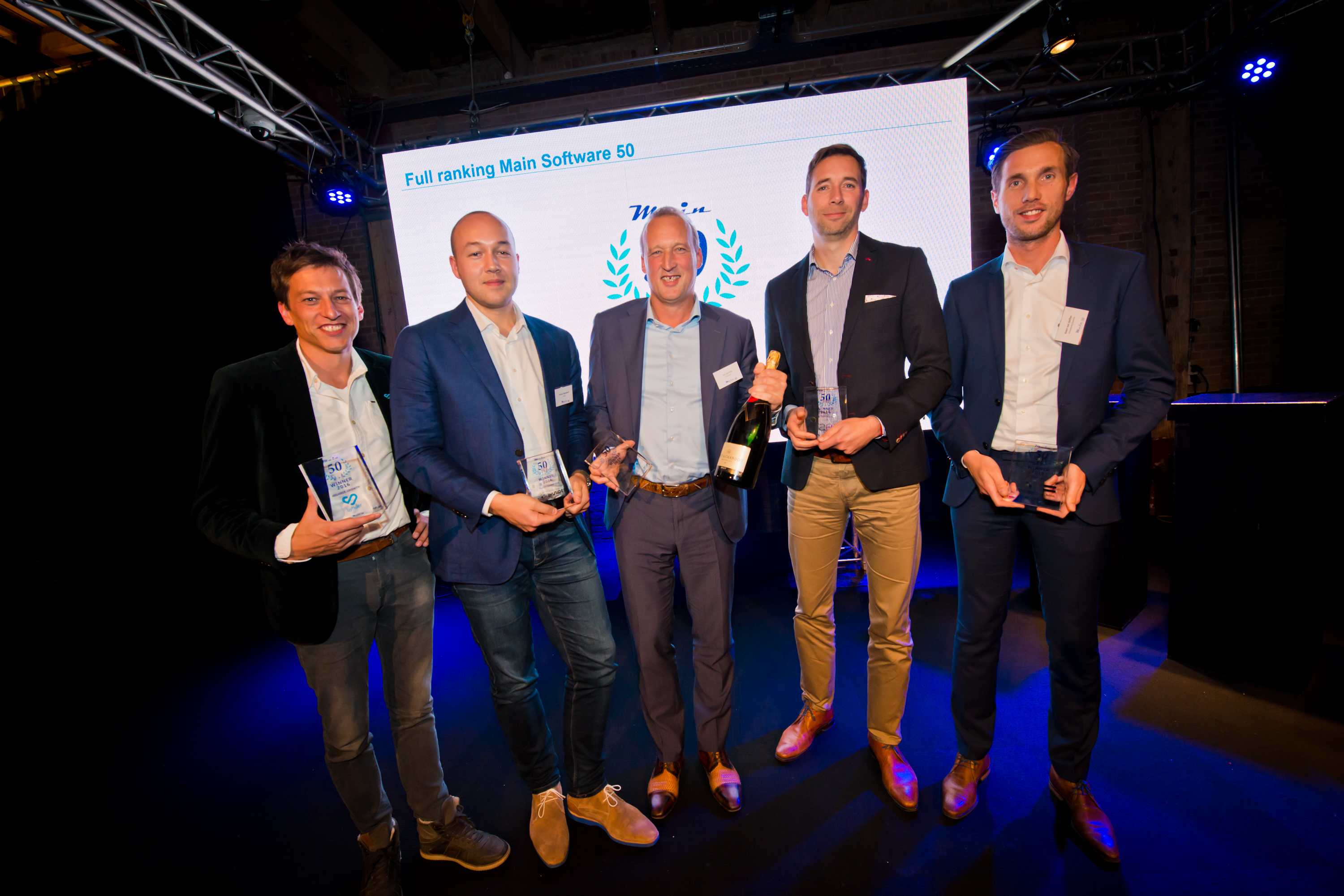 De winnaars met Eric van Dijk van Slimstock in het midden.