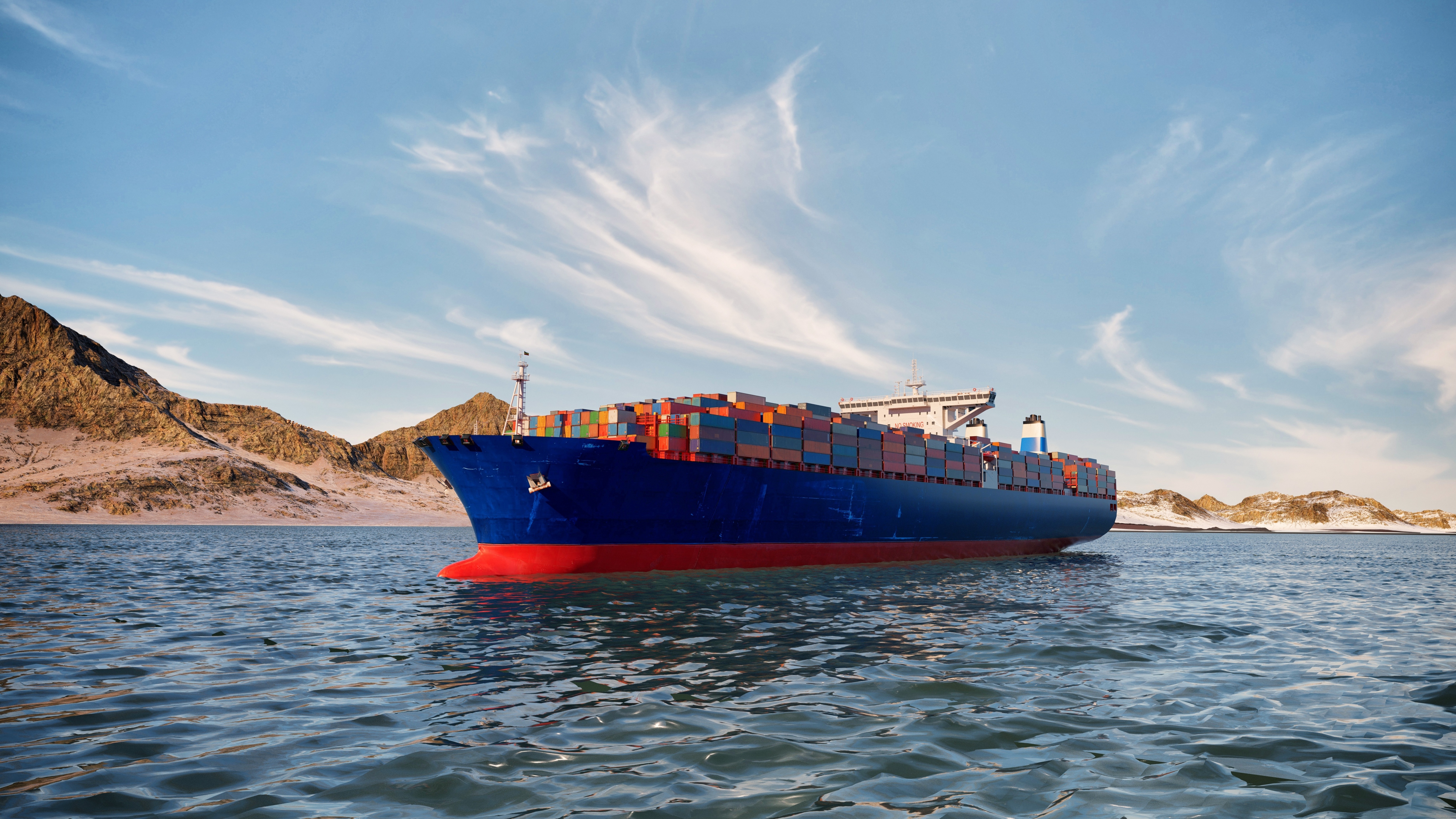 Een containerschip in de Straat van Hormuz. Foto Shutterstock